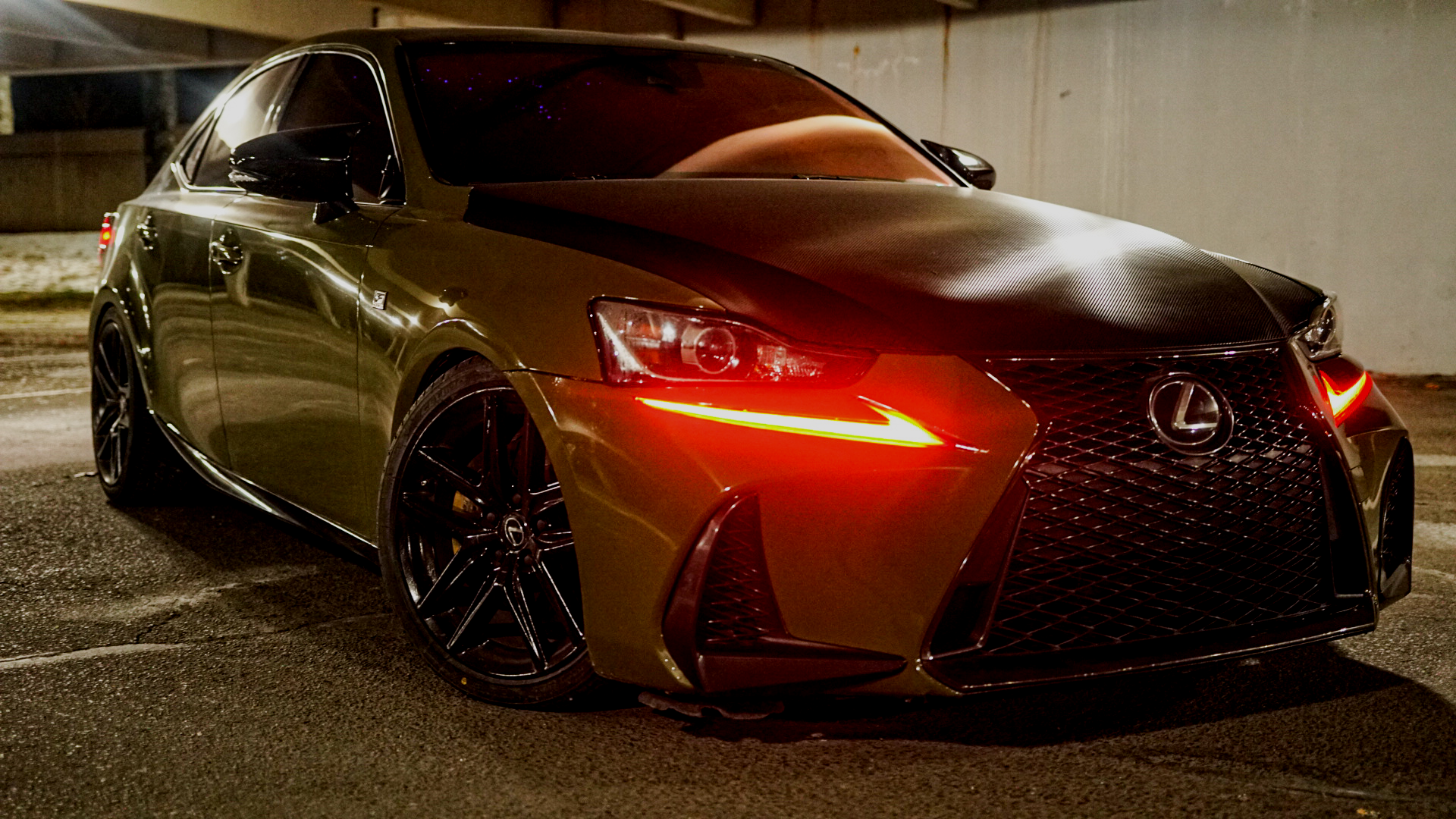 Lexus with a carbon-look hood and striking custom lights